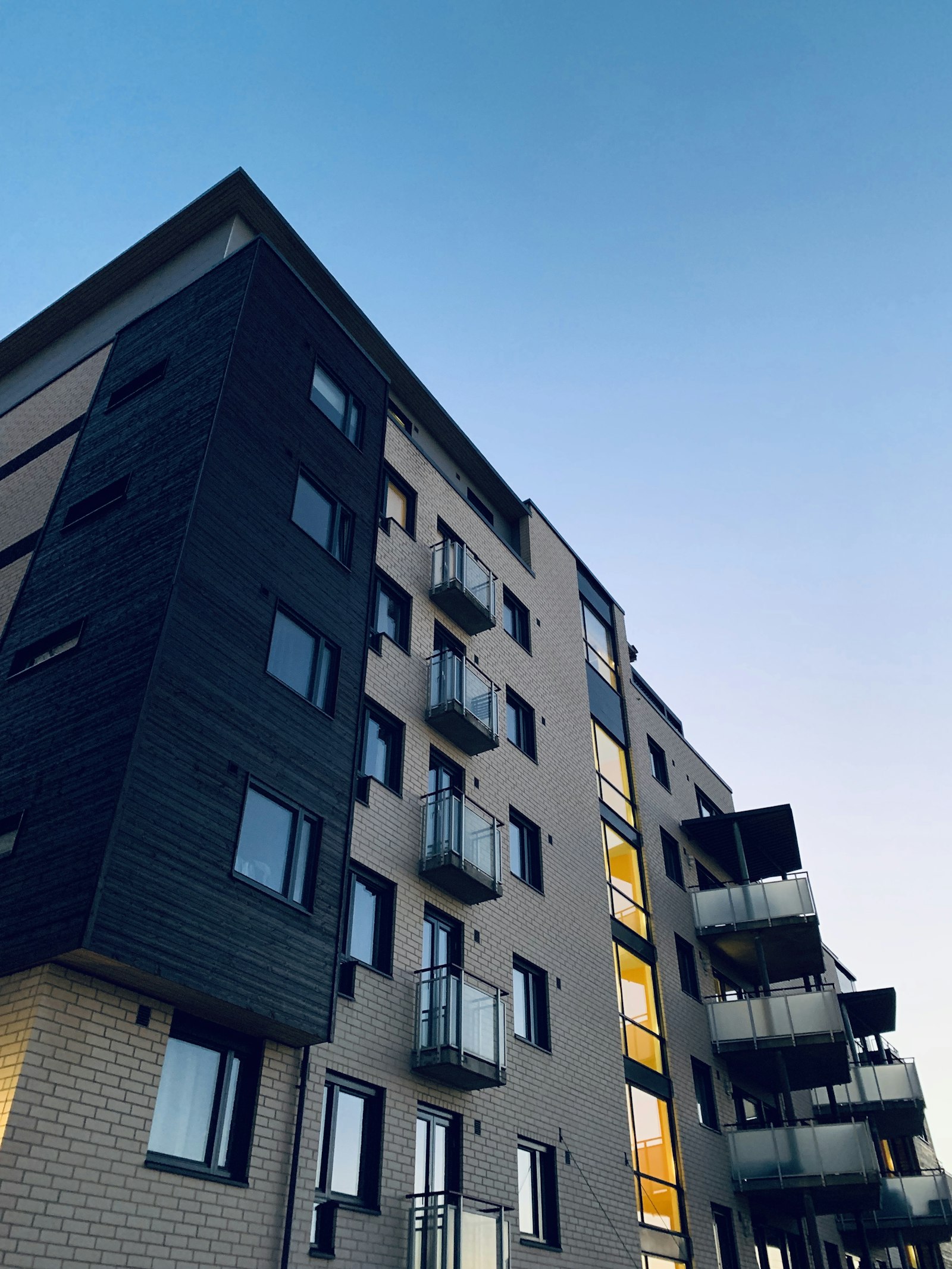Facade of a multifamily building with balconies.